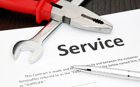 Service contract displayed with tools and a pen