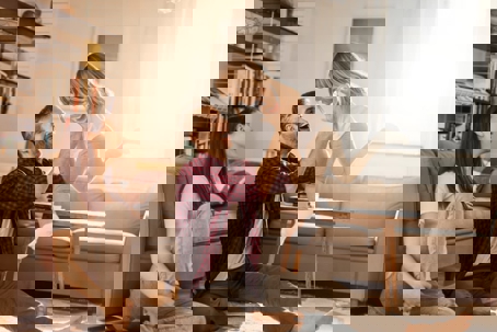 A happy family enjoys a bright, airy living room