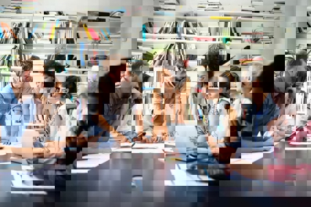 A diverse team collaborates at a table