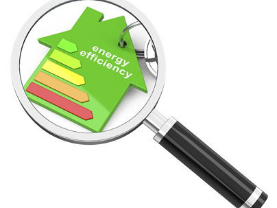 A green house-shaped keychain with an energy efficiency label